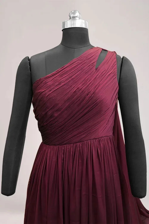 The Ethereal One-Shoulder bodice in wine georgette, the fabric ruched diagonally across one shoulder with a narrow cut away opening at the top